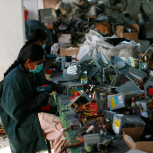A worker managing E-waste Scrap